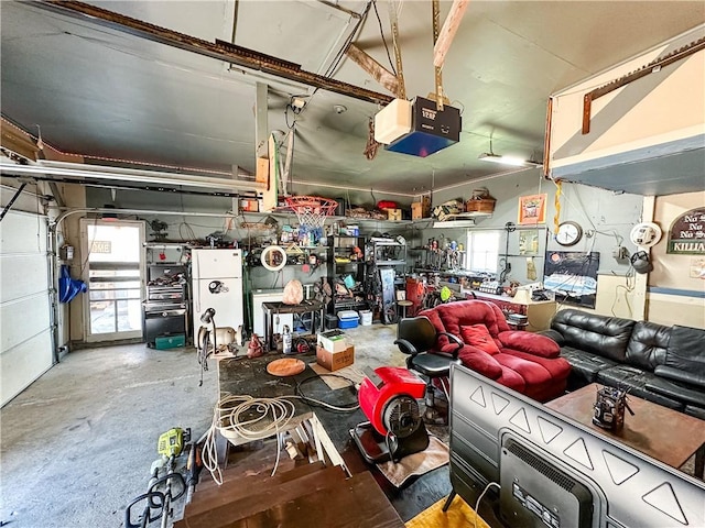 421 S 8th St, Marshall, IL 62441 - garage featuring a garage door opener and a workshop area