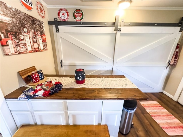 421 S 8th St, Marshall, IL 62441 - detailed view of a barn door, ornamental molding, and wood finished floors