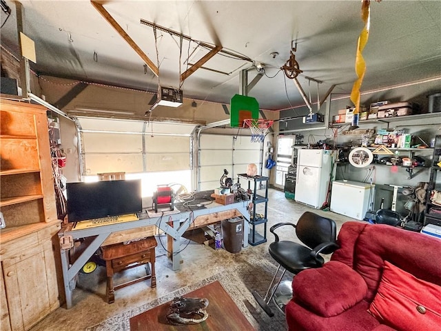 421 S 8th St, Marshall, IL 62441 - garage with freestanding refrigerator, a garage door opener, and fridge