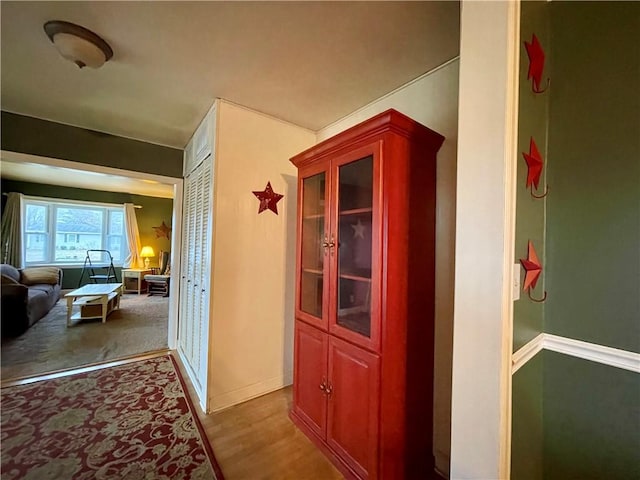 hall with dark hardwood / wood-style flooring