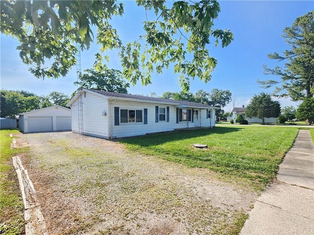324 Madison St, Mason, IL 62443 - ranch-style house with an outdoor structure, a garage, and a front lawn