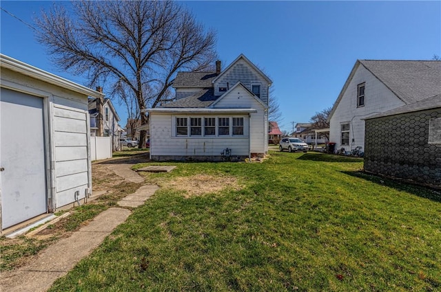 109 S Saint John St, Assumption, IL 62510 - rear view of house with a lawn