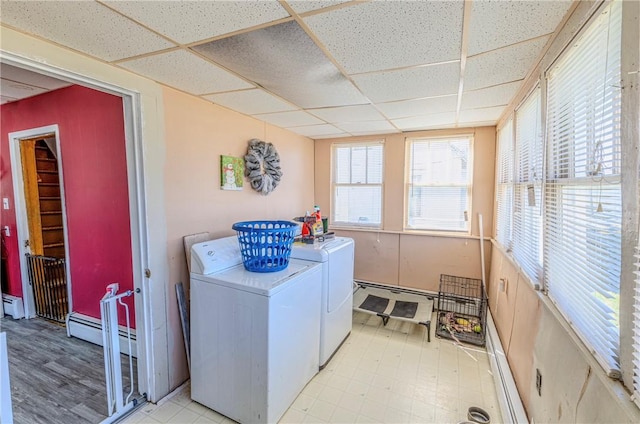 109 S Saint John St, Assumption, IL 62510 - laundry area with a baseboard radiator, washing machine and clothes dryer, laundry area, a baseboard heating unit, and tile patterned floors