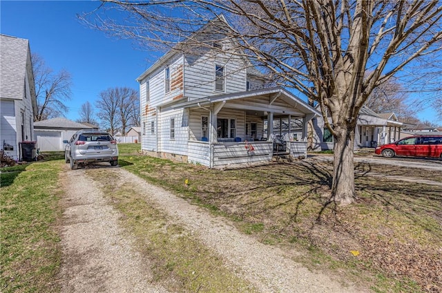 109 S Saint John St, Assumption, IL 62510 - view of front of home with covered porch and dirt driveway