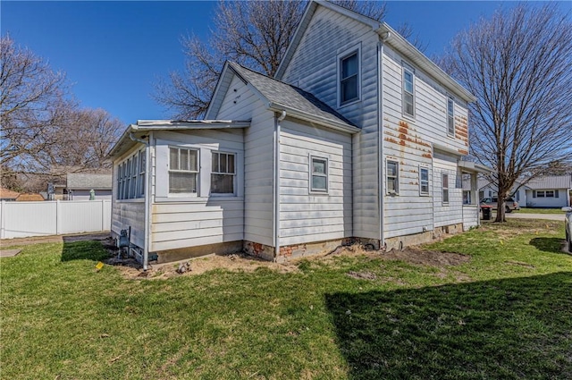 109 S Saint John St, Assumption, IL 62510 - view of side of property featuring a yard and fence