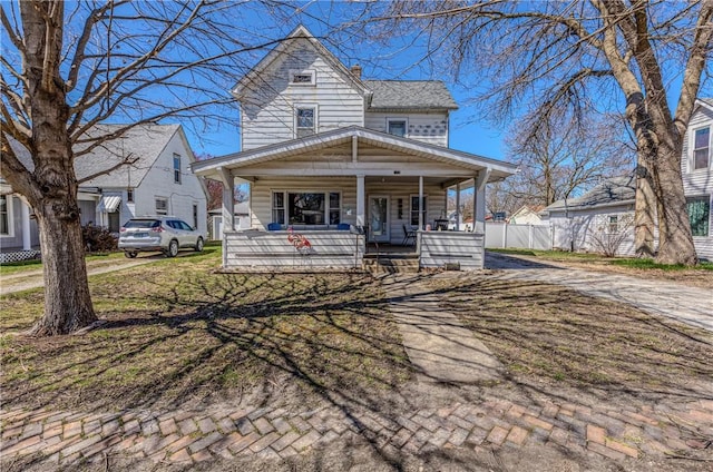 109 S Saint John St, Assumption, IL 62510 - view of front of house with covered porch and fence