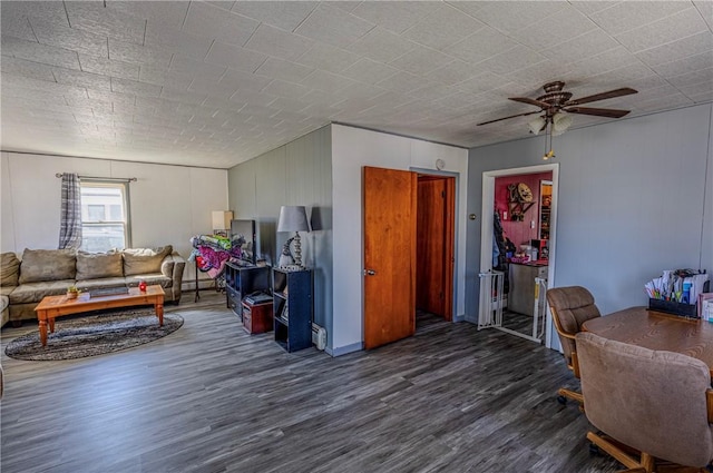 109 S Saint John St, Assumption, IL 62510 - living area featuring wood finished floors and ceiling fan