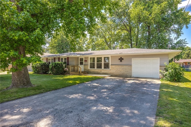 ranch-style house with a garage and a front yard