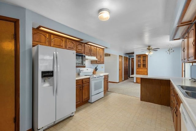 kitchen featuring white appliances and ceiling fan