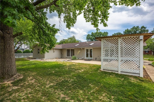 back of property featuring french doors and a patio
