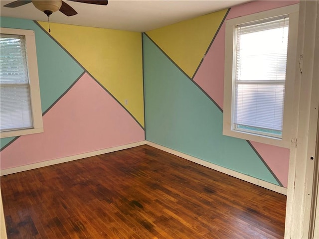 605 W Reynolds St, Newton, IL 62448 - empty room featuring a ceiling fan, hardwood / wood-style floors, and healthy amount of natural light