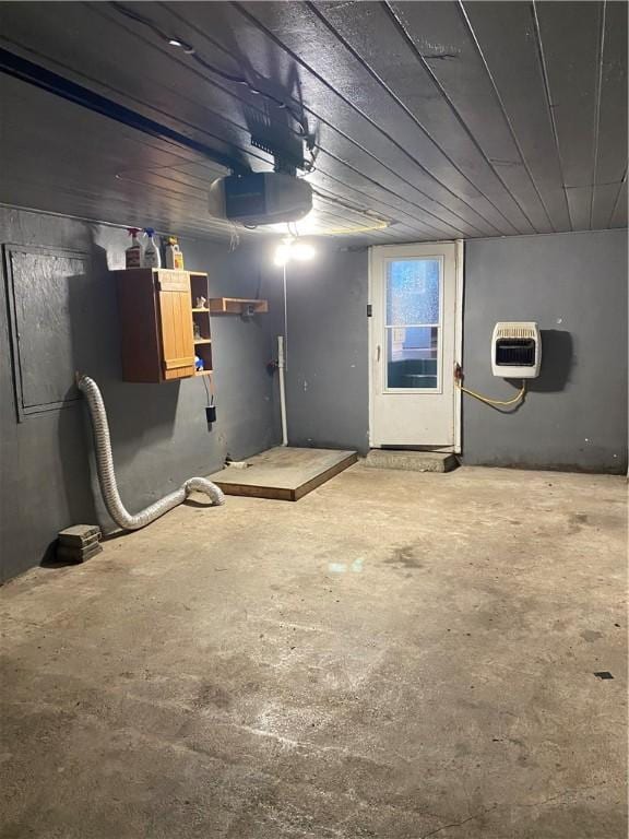 605 W Reynolds St, Newton, IL 62448 - garage with heating unit and a garage door opener
