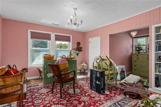 interior space with crown molding and a chandelier