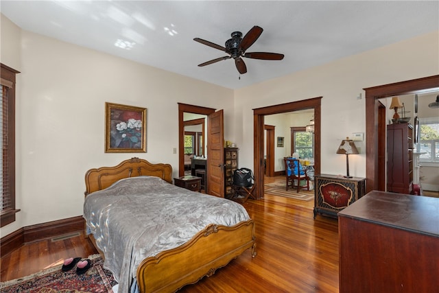 bedroom featuring dark hardwood / wood-style flooring and ceiling fan