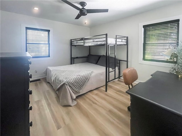 bedroom with light wood finished floors, baseboards, a ceiling fan, and recessed lighting