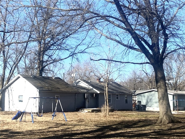 rear view of house with a playground