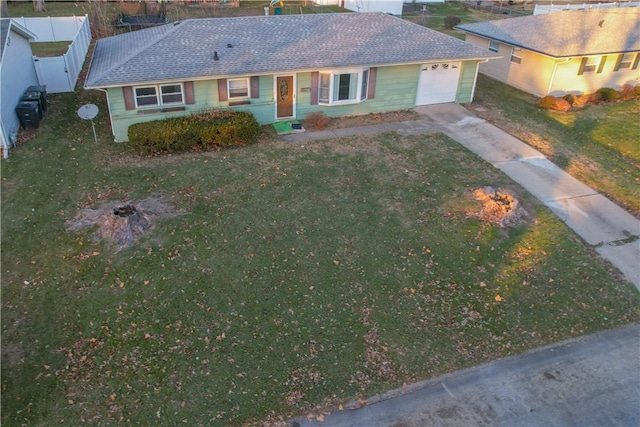 view of front of house with a garage and a front yard