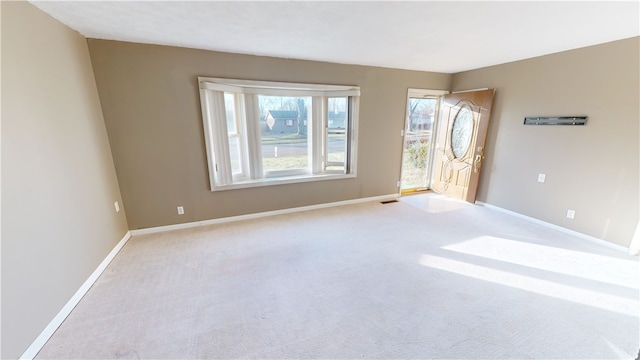 empty room featuring light colored carpet