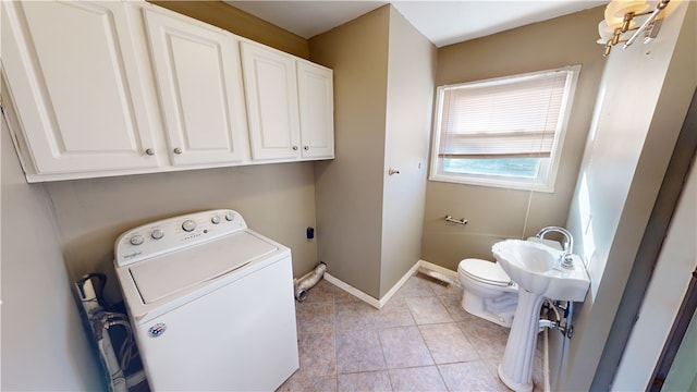 clothes washing area featuring light tile patterned flooring and washer / clothes dryer