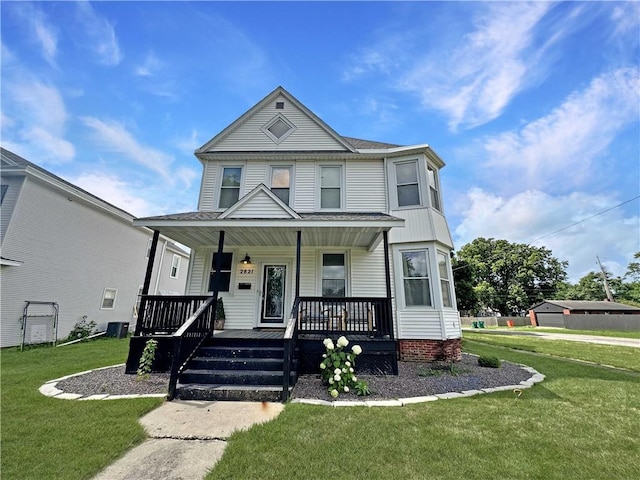 2821 Western Ave, Mattoon, IL 61938 - view of front facade with covered porch and a front lawn