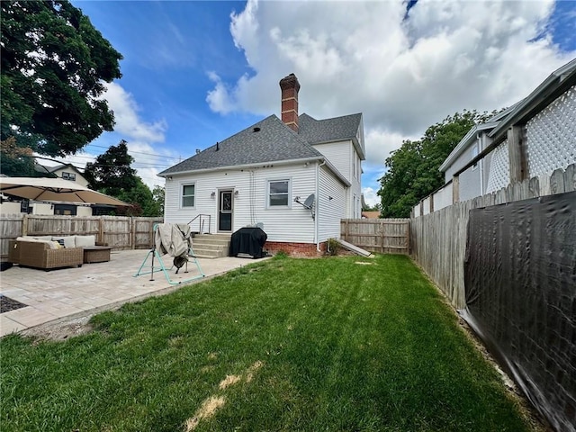 2821 Western Ave, Mattoon, IL 61938 - back of house with an outdoor hangout area, a chimney, a patio area, and a fenced backyard