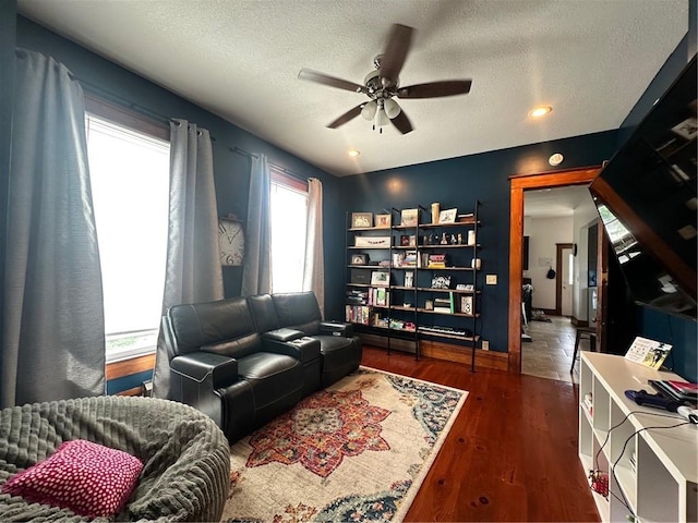 2821 Western Ave, Mattoon, IL 61938 - living area featuring a ceiling fan, a textured ceiling, and wood finished floors