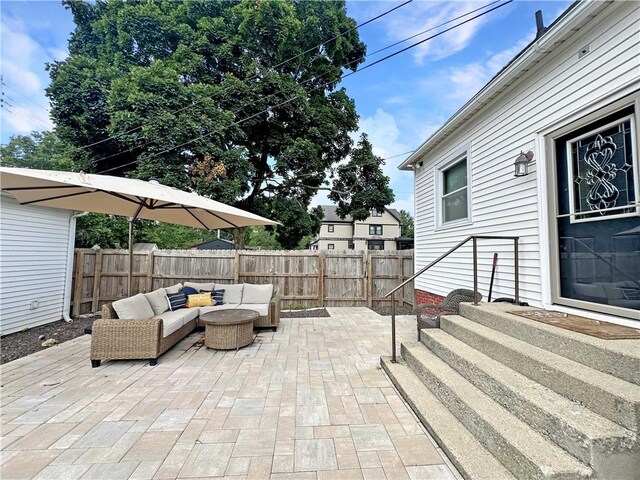 2821 Western Ave, Mattoon, IL 61938 - fenced backyard featuring an outdoor hangout area, a patio, and entry steps