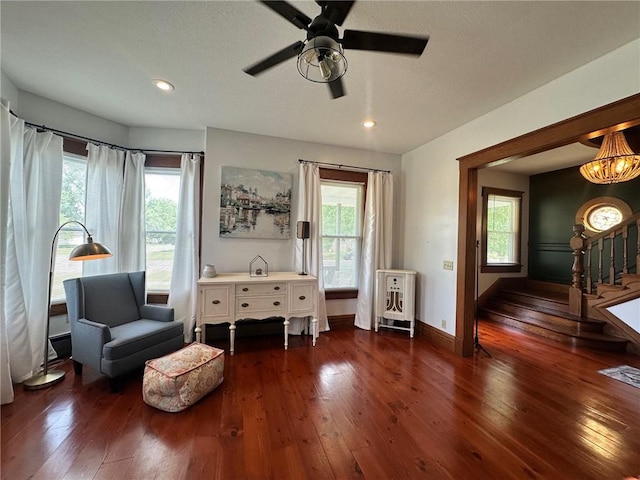 2821 Western Ave, Mattoon, IL 61938 - living area featuring dark wood-style flooring, heating unit, recessed lighting, a ceiling fan, and stairs