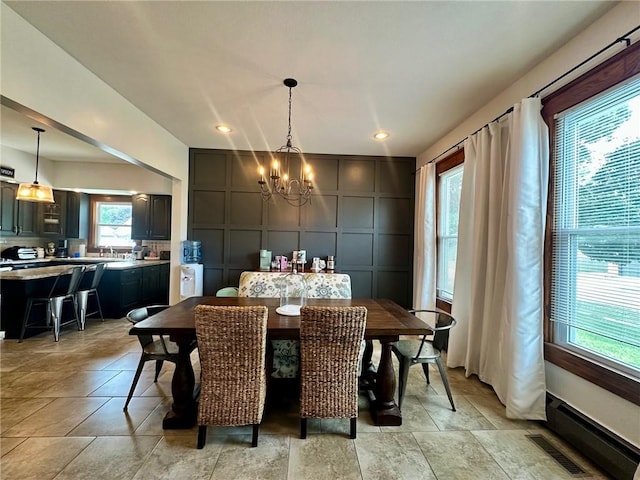 2821 Western Ave, Mattoon, IL 61938 - dining area featuring a decorative wall, a chandelier, and recessed lighting