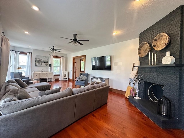 2821 Western Ave, Mattoon, IL 61938 - living room with wood finished floors, a fireplace, a ceiling fan, and recessed lighting