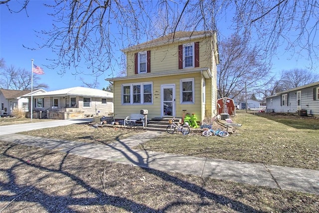 view of front of property featuring concrete driveway