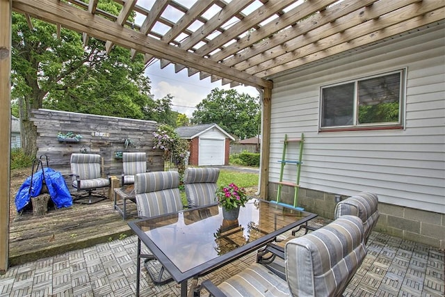 236 N Dennis Ave, Decatur, IL 62522 - wooden deck featuring outdoor dining space, a pergola, an outbuilding, and a patio