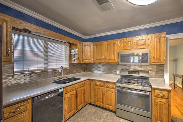 236 N Dennis Ave, Decatur, IL 62522 - kitchen with appliances with stainless steel finishes, decorative backsplash, crown molding, brown cabinetry, and light countertops