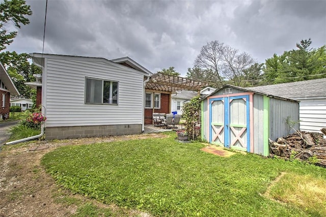 236 N Dennis Ave, Decatur, IL 62522 - back of property with a shed, a pergola, a yard, and a patio area