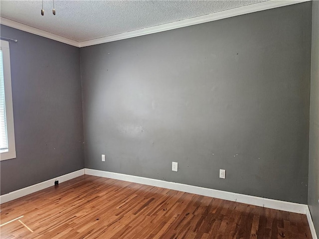 241 S Main St, Argenta, IL 62501 - empty room featuring wood finished floors, a textured ceiling, and crown molding