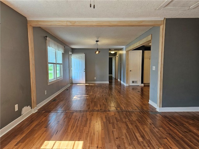 241 S Main St, Argenta, IL 62501 - spare room with a textured ceiling and wood finished floors