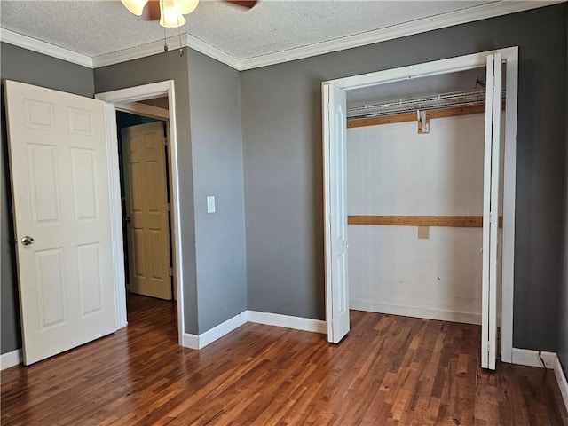 241 S Main St, Argenta, IL 62501 - unfurnished bedroom with wood finished floors, a closet, crown molding, a textured ceiling, and a ceiling fan