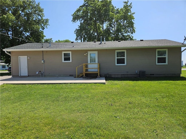 241 S Main St, Argenta, IL 62501 - rear view of house featuring crawl space, a lawn, and a patio area