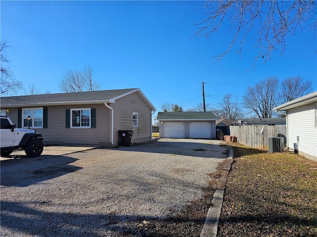 view of home's exterior with a garage, central air condition unit, an outdoor structure, and fence