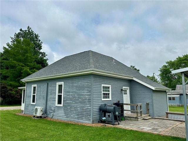 302 E Van Buren St, Paris, IL 61944 - rear view of house featuring a yard and a shingled roof