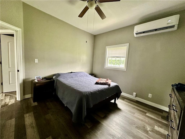 302 E Van Buren St, Paris, IL 61944 - bedroom with a wall mounted AC, wood finished floors, and a ceiling fan