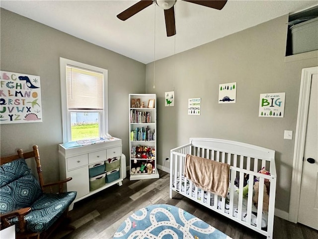 302 E Van Buren St, Paris, IL 61944 - bedroom with wood finished floors, a nursery area, and ceiling fan