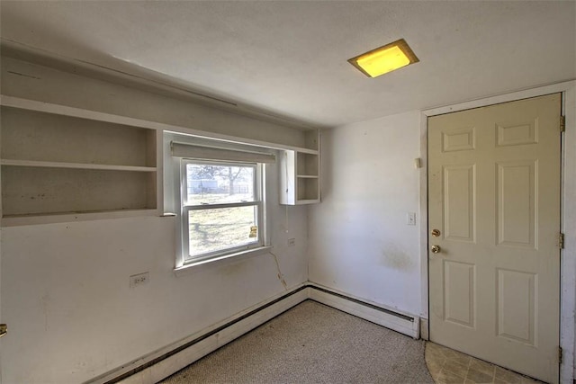 spare room featuring a baseboard radiator