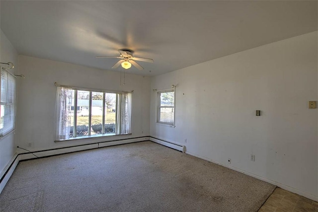 empty room with light carpet, baseboards, a baseboard heating unit, and ceiling fan