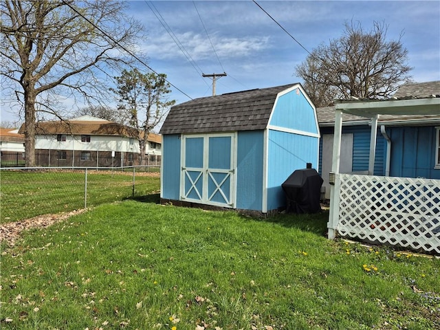 view of shed with fence
