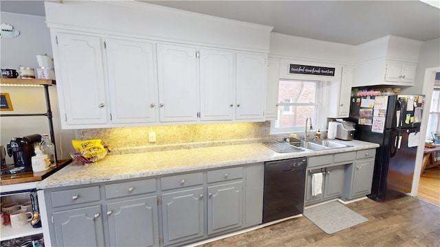 215 E Winter Ave, Danville, IL 61832 - kitchen with black appliances, gray cabinets, light wood finished floors, backsplash, and white cabinetry