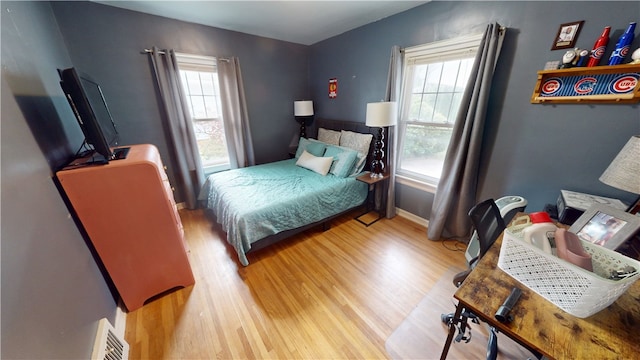 215 E Winter Ave, Danville, IL 61832 - bedroom with wood finished floors and multiple windows