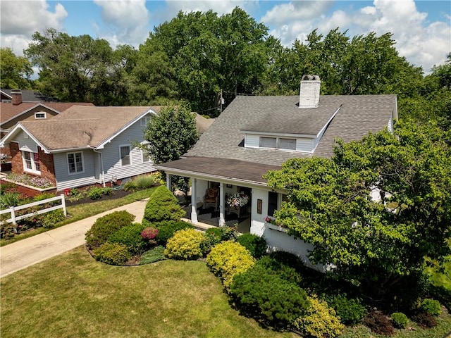 215 E Winter Ave, Danville, IL 61832 - view of front of house featuring a chimney, a shingled roof, and concrete driveway