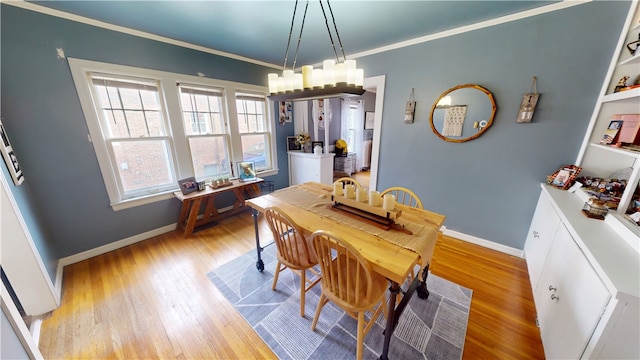 215 E Winter Ave, Danville, IL 61832 - dining area with light wood finished floors and ornamental molding