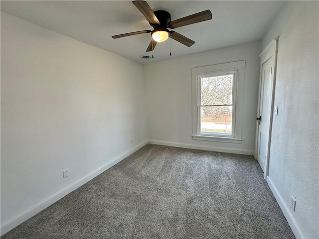 empty room with carpet and ceiling fan